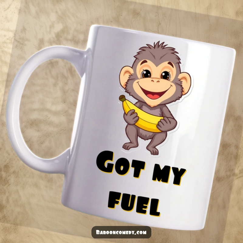 Funny baboon character with a wide, mischievous grin holding a ripe banana, featured on a mug. Great for coffee and humor enthusiasts.