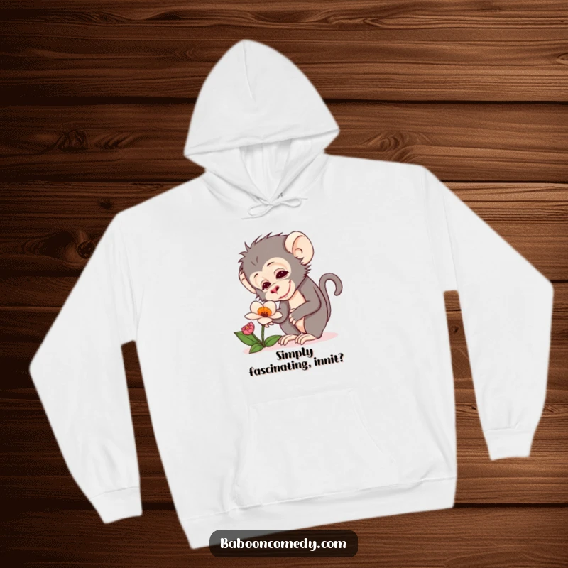 Funny hoodie featuring a baboon with a look of pure delight curiously inspecting an unusual, vibrant flower.