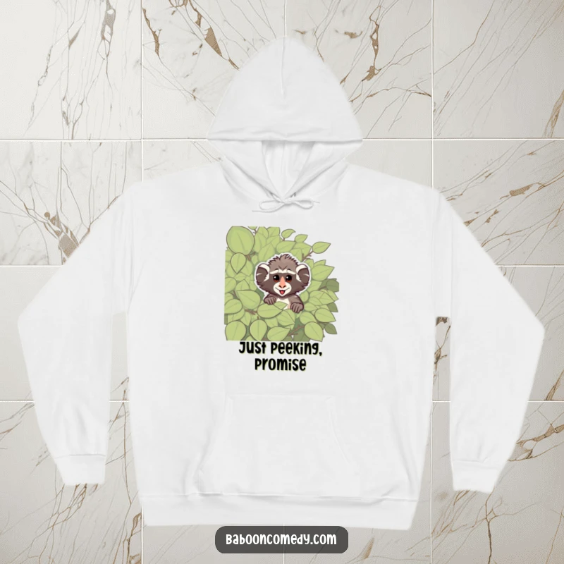 Funny hoodie featuring a cheeky baboon peeking from a large, leafy bush, designed for cozy and playful primate-themed enjoyment.