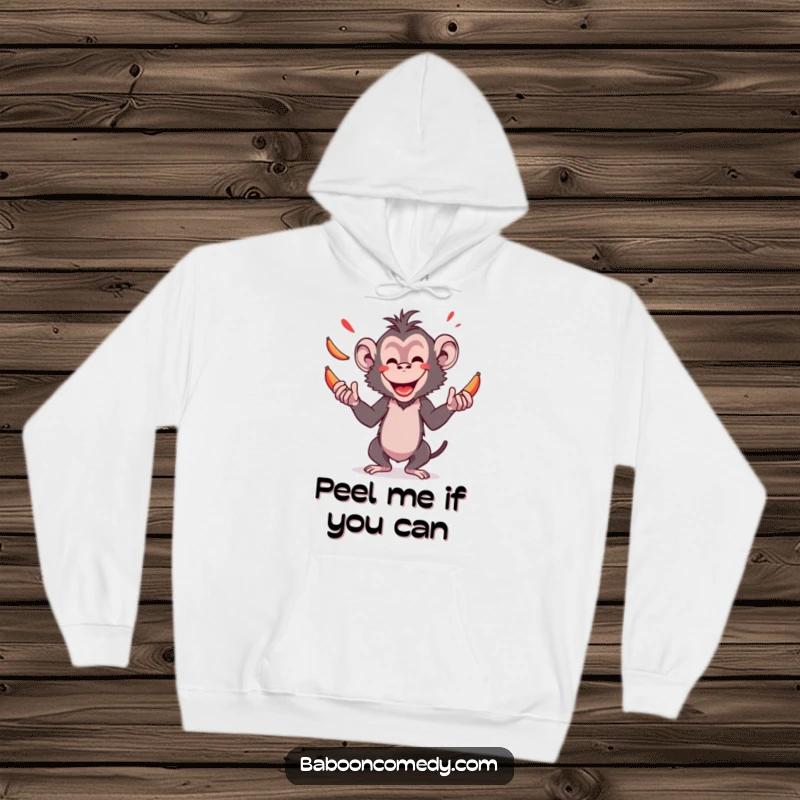 Cozy funny hoodie featuring an amused baboon masterfully juggling red bananas, radiating pure joy and impressive dexterity for all to see.