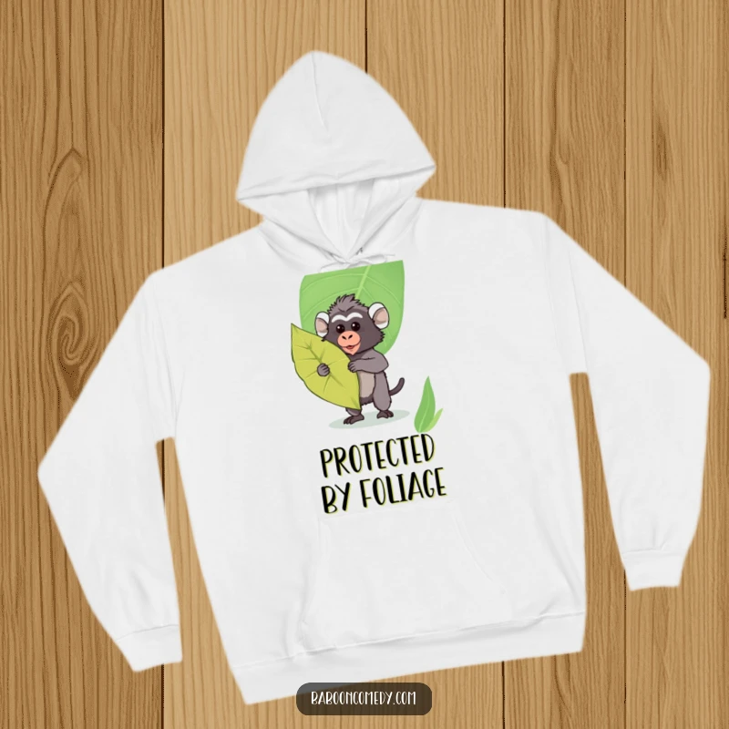 Funny Kawaii Baboon Hoodie: Cute baboon posing with a large leaf shield, offering cozy protection and adorable style.