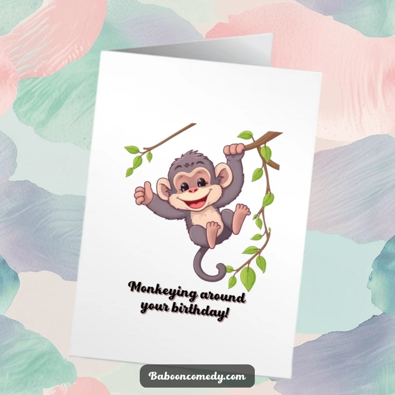 Funny Free Printable baboon card, mischievously swinging from a vine with a wide, cheeky grin, celebrating a birthday.
