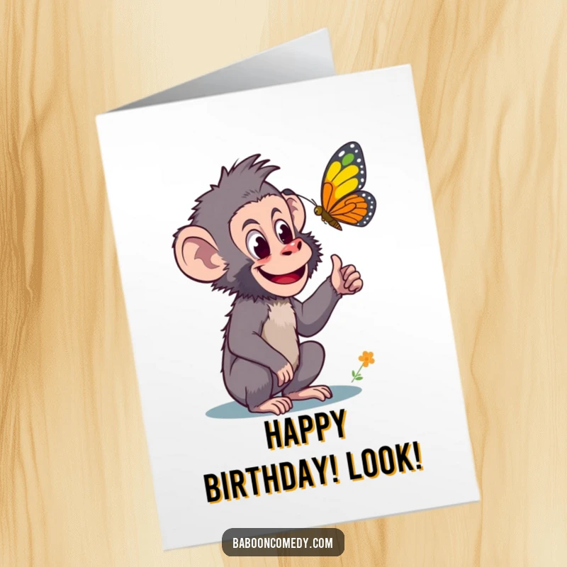 Funny Free Printable Birthday Card: A curious baboon pointing excitedly at a vibrant, colorful butterfly in flight. A playful design.