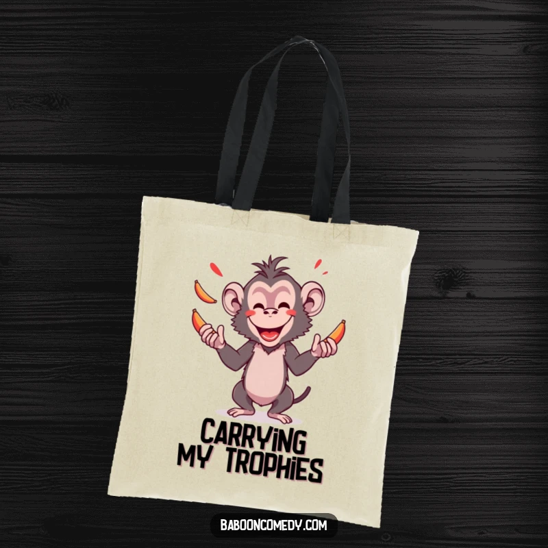 Funny tote bag showcasing an amused baboon performing an impressive juggling act with bright red bananas, a delightful and practical accessory.